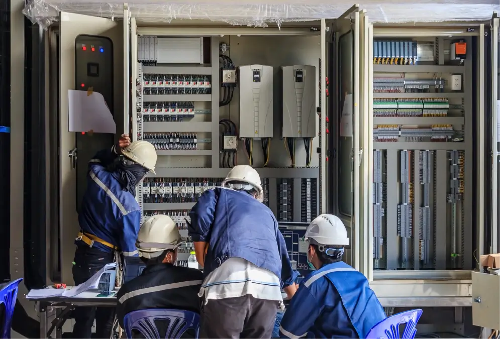 Electrical_engineers_installing_plc